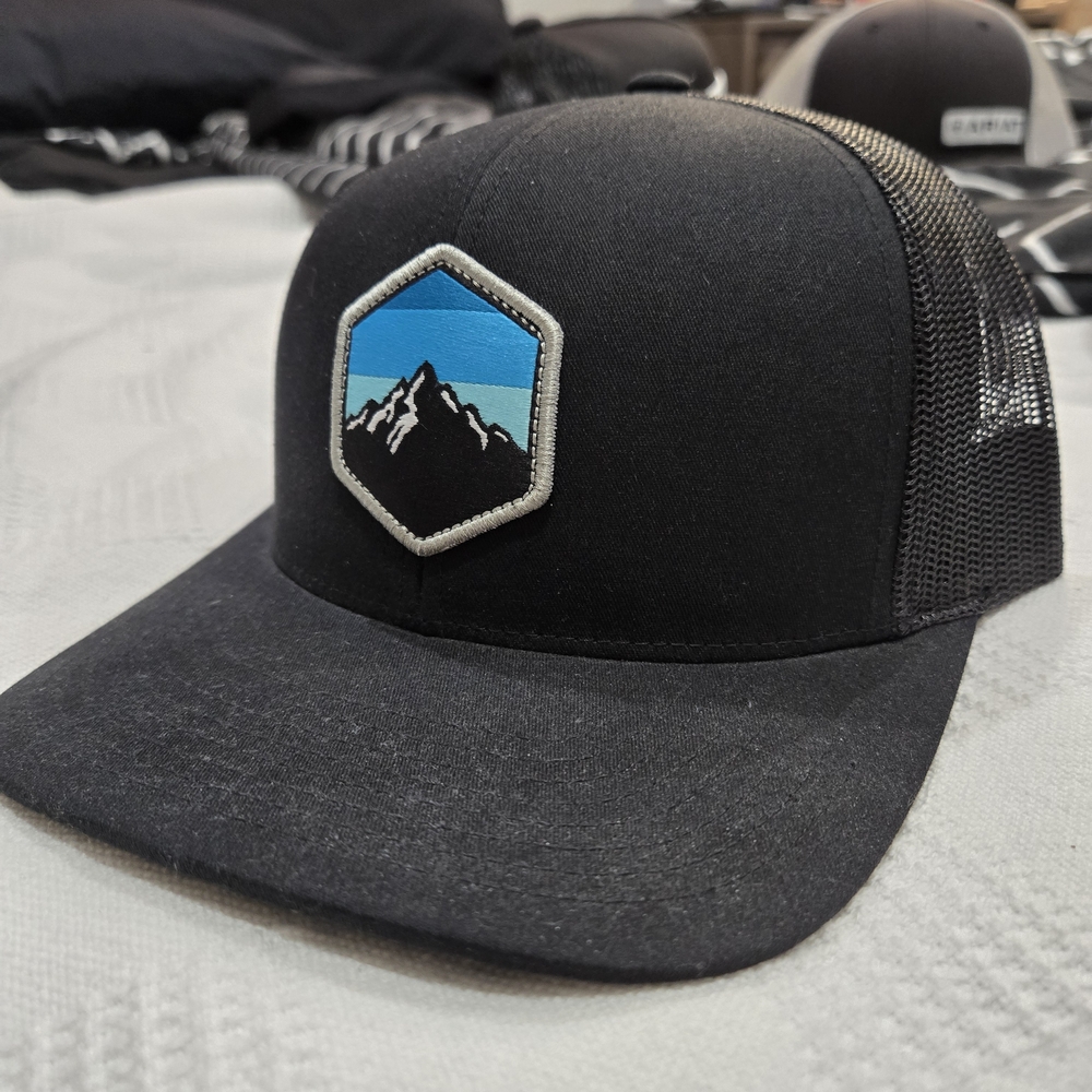 Black Trucker Hat With Mountain Patch - image 1